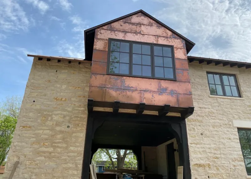 Copper metal panel facade on a stone building for Skylight Installation in Maryland Heights