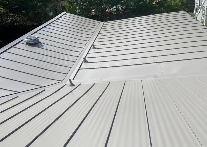 Solar attic fan installed on a metal roof for Roof Ventilation in Maryland Heights